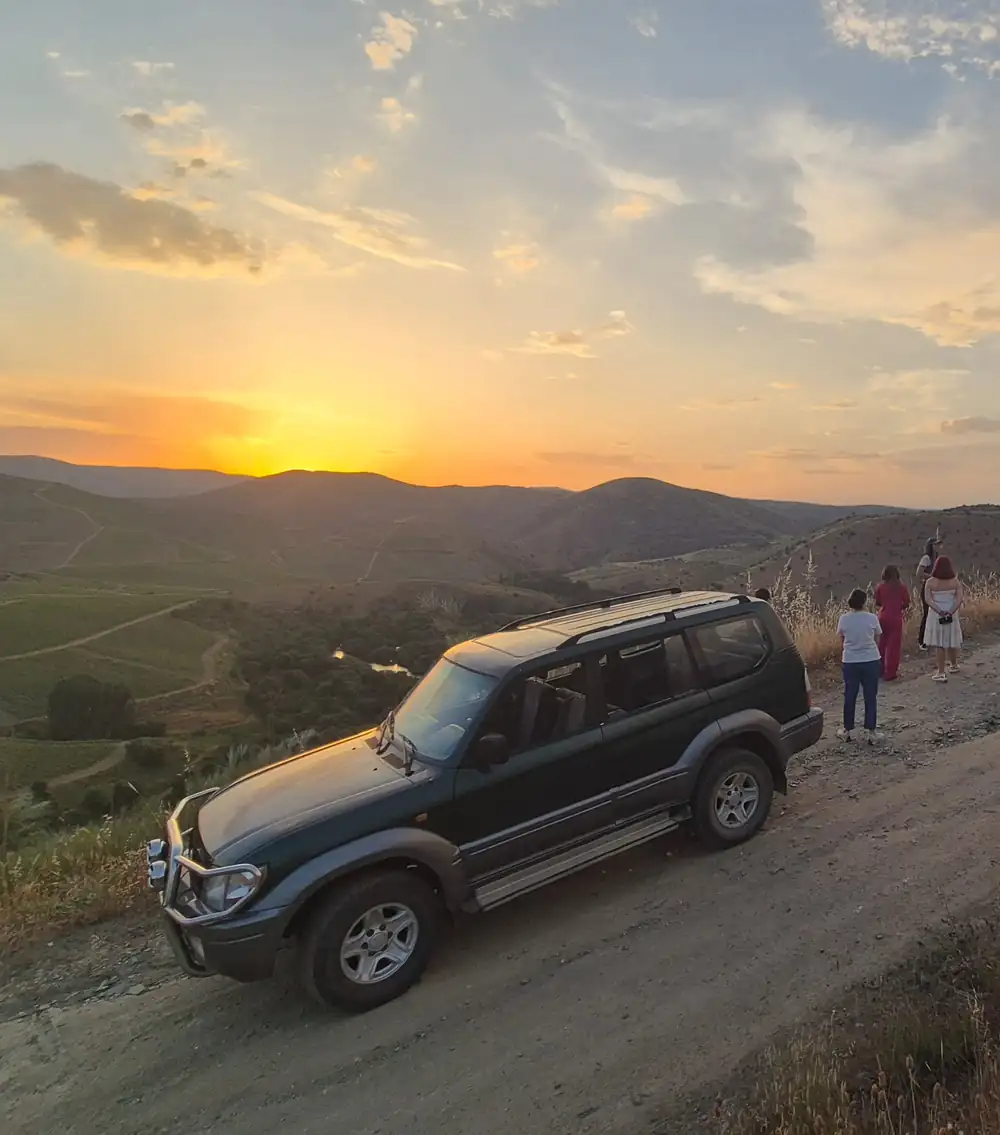 Jeep 4x4 tour at sunset over the Douro vineyards